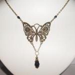 Lovely Black Crystal Drop Filigree Butterfly..